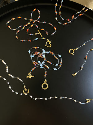 Waterproof body chains in the colors blue, res, yellow, orange, gold and freshwater pearls