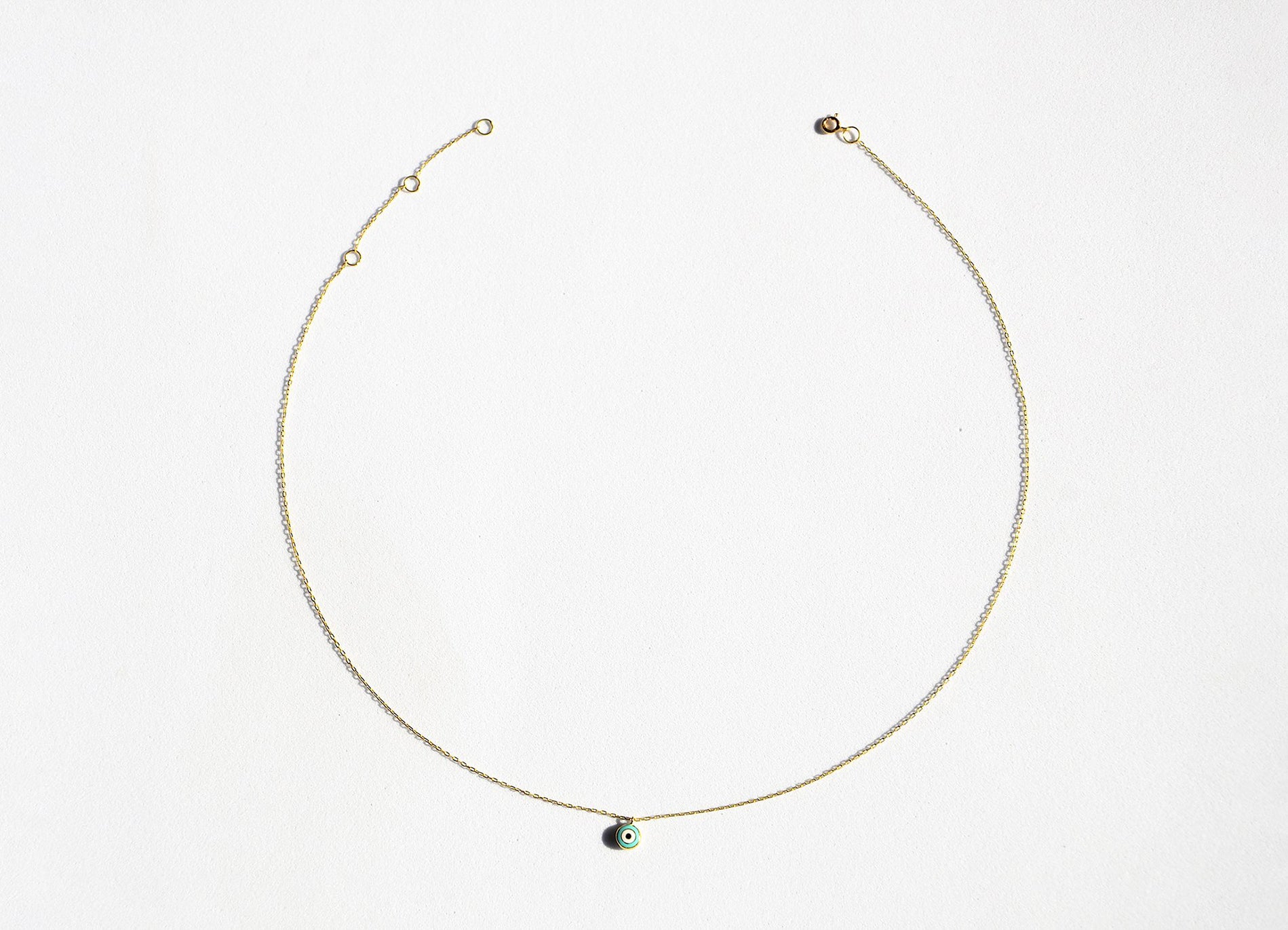 Golden filigran neckless out of 18k solid gold with small turquoise evil eye pendant - 40cm length with 4cm extensions.